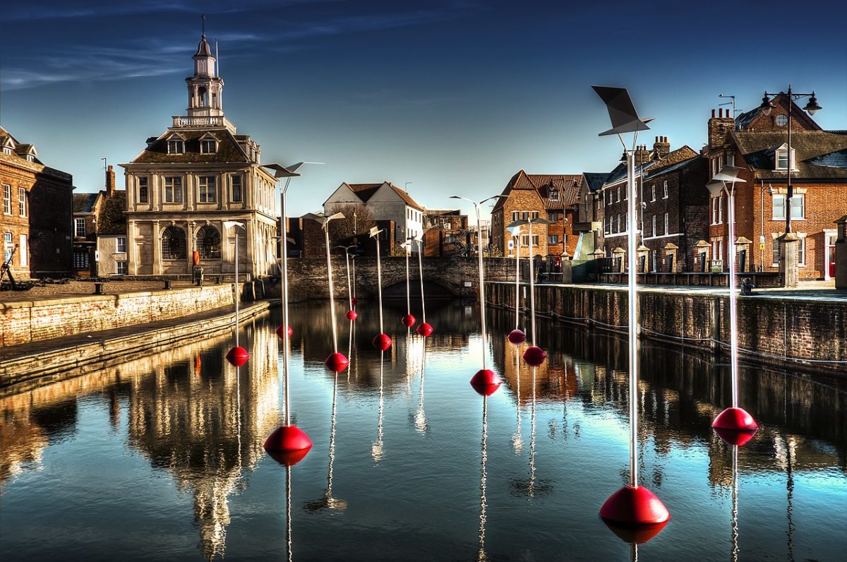 Historic waterfront buildings reflected in the water